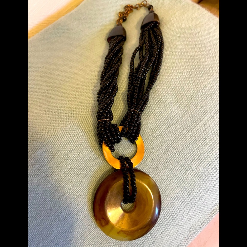 Chico’s black bead necklace w/tortoise disc